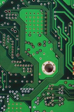Green computer board with chips and components. Stock Photos