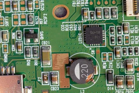 Green computer board with different electronics elements. texture Stock Photos