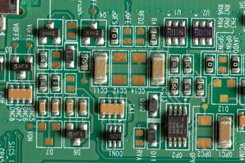Green computer board with different electronics elements. texture Stock Photos