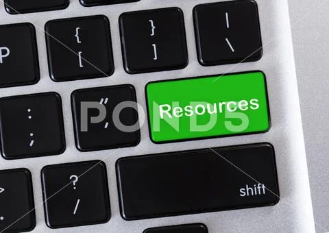 Green computer keyboard button with Resources word Stock Photos