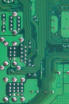 Green Computer motherboard surface of technology background. Stock Photos