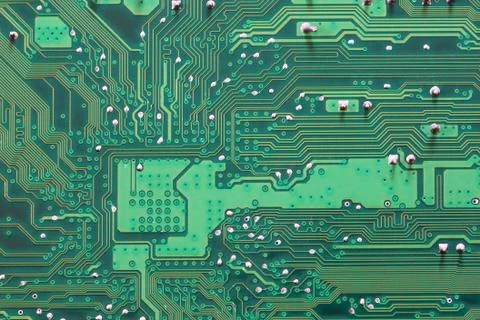 Green Computer motherboard surface of technology background. Stock Photos