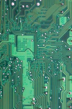 Green Computer motherboard surface of technology background. Stock Photos