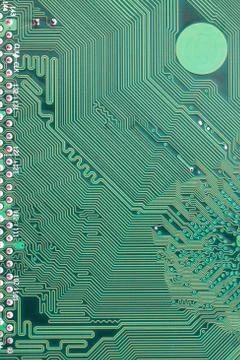 Green Computer motherboard surface of technology background. Stock Photos