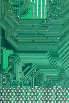 Green Computer motherboard surface of technology background. Stock Photos