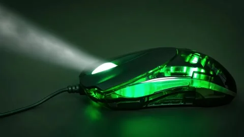 Green computer mouse with a green light on it Stock Footage 305340693