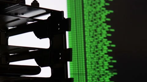 Green computer software code moving on a black monitor reflect on glass. Abst Stock Footage 143673595