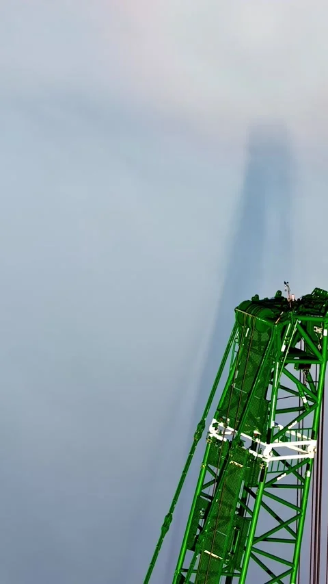 Green Construction Crane Mast Against Cloudy Sky Background Stock Footage 336228685