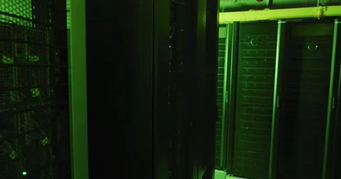 Green control lights and data processing on computer servers in tech room Video stock 341936175