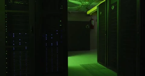 Green control lights flashing with data processing on computer servers in tech 스톡 동영상 346294391