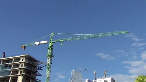 A green crane on a construction site Stock Footage 112140750