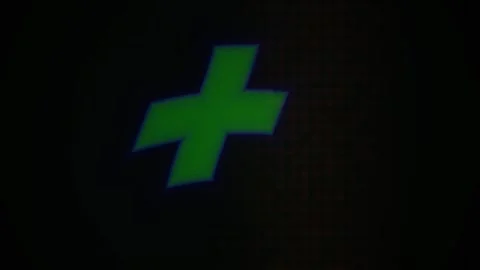 Green Cross Symbol Rotating on Dark Screen for Creative Templates Stock Footage 343711319
