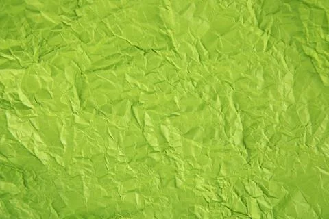 Green crumpled background or texture. Stock Photos