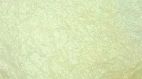 Green crumpled plastic bag texture background rotating. Low-Density Polyethylene Video stock 316379181
