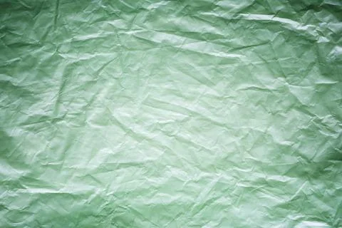 Green crumpled plastic pattern for background texture Stock Photos