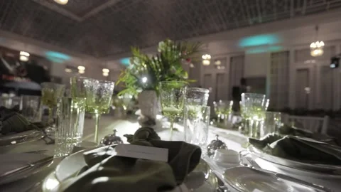 GREEN CRYSTAL GLASSES ON THE TABLE Stock Footage 300031346