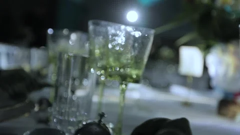 GREEN CRYSTAL GLASSES ON THE TABLE Stock Footage 300031368