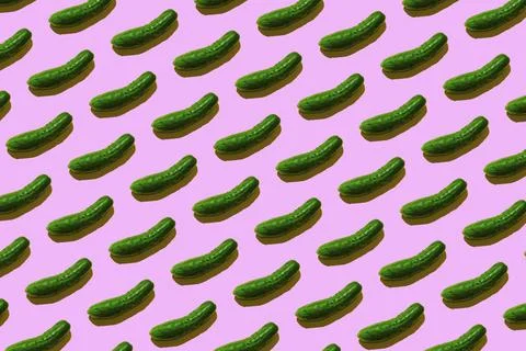 Green cucumber pattern on light pink background pop art design Stock Photos