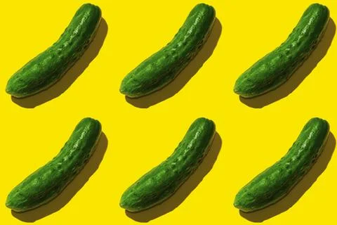Green cucumber pattern on yellow background pop art design Stock Photos