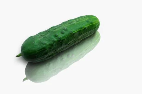 Green cucumber with reflection on white background. Eco healthy food for vega 스톡 사진