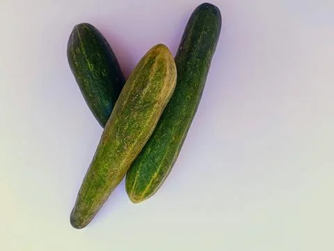 Green cucumber on a white background Stock Photos