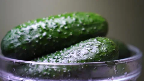 Green cucumbers in the kitchen under the tap water close up slow motion Stock Footage 135413846