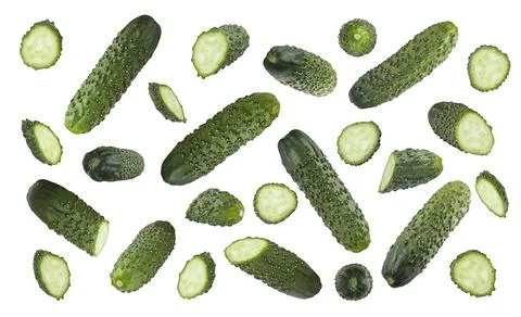 Green cucumbers pattern, isolated. Mix of fresh green cucumbers - whole, half Stock Photos