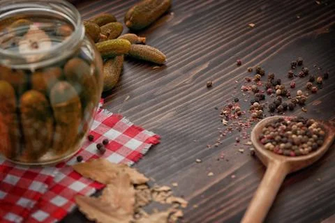 Green Cucumbers, Pepper, Bay Leaf  on the Wooden Table Stock Photos