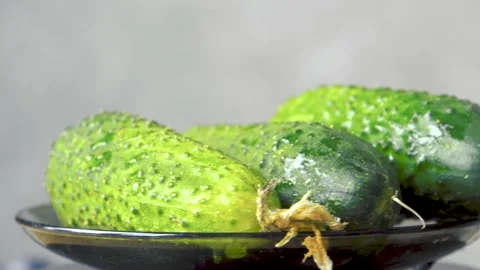 Green cucumbers on a plate 4K Stock-Footage 196871740