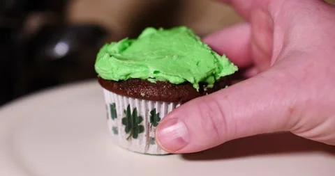 Green cup cake with four leaf clovers st Patrick day Stock Footage 150607275
