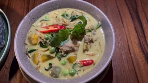 Green curry with catfish Stock Footage 323242684