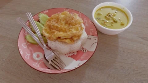 Green curry with omelet Stock Footage 258290421