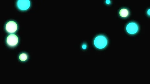 Green cyan blur light bokeh on dark black background with soft glowing circles, Stock Footage 338330899