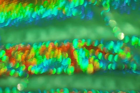 Green defocused abstract background with red and blue. Christmas, New Year Stock Photos