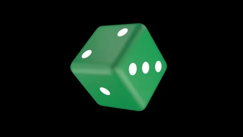 The green dice rotates against the background of a black screen. Stock Footage 243706241