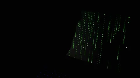 Green Digital Code Rain Falling on Computer Monitor in Dark Room Видео 334733433