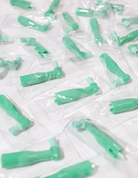 Green Disposable Prophy Angles with Brush, Ergonomic Shape on White Background Stock Photos