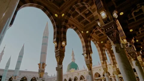 Green dome and Moorish pattern arches of Nabawi mosque in Medina Saudi Arabia. Stock Footage 318524698