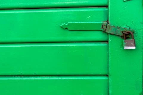 Green door with lock Stock Photos