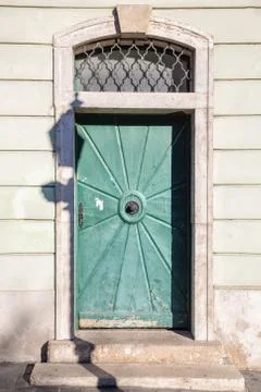 Green door on old wall Stock Photos