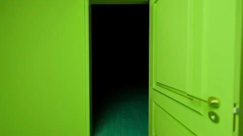 Green door opening into darkness in empty room Stock Illustration