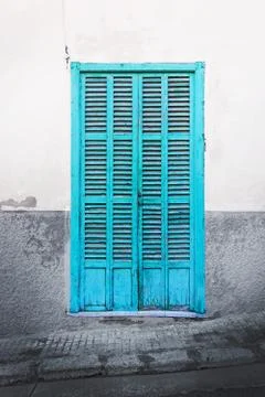 Green door on rustic wall Stock Photos