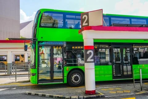 Green Double Decker Bus the final bus station, waiting for passengers, ready  Stock Photos