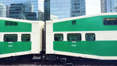 Green double-decker commuter train cars. Stock-Footage 334583772