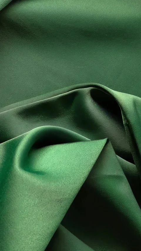 Green draped cloth motion background, flowing textile texture and elegant fabric Stock Footage 335743958