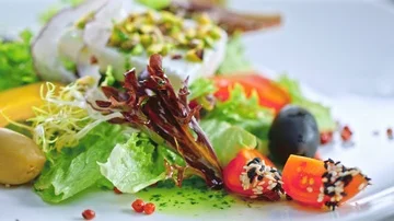 Green dressing pouring over mixed salad Stock Footage 85602653