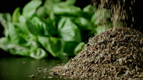 Green dried basil leaves falling in a heap Stock-Footage 139996705