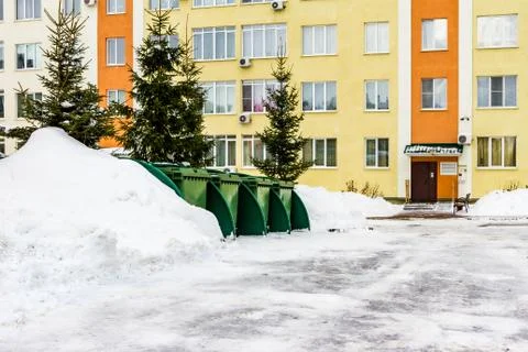 Green dumpsters in the yard Stock Photos
