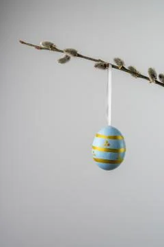 Green easter egg hanging from a willow twig with catkins Stock Photos