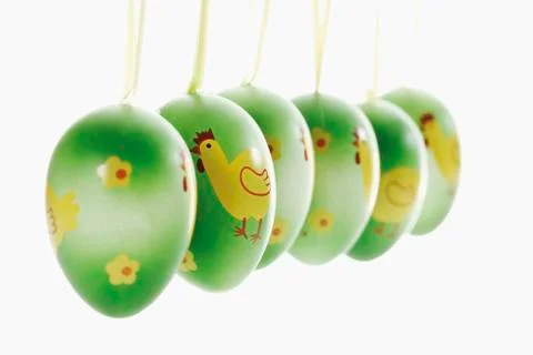 Green Easter eggs with hanging loops Stock Photos